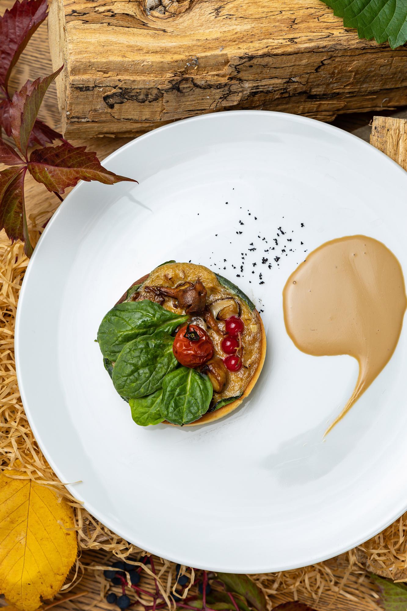 Plated tasting course on wooden table